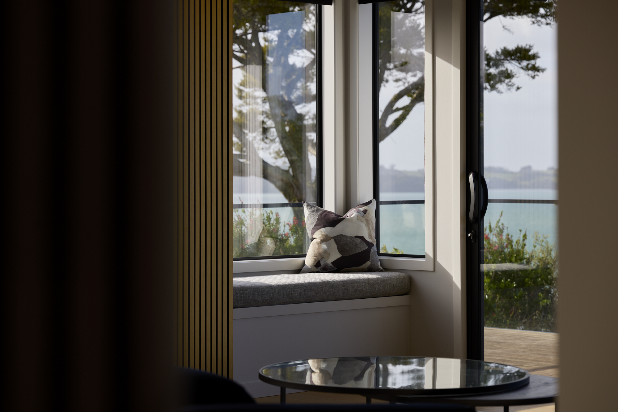 Corner window and sliding door featuring FMI Building Innovation high performance window and door profiles